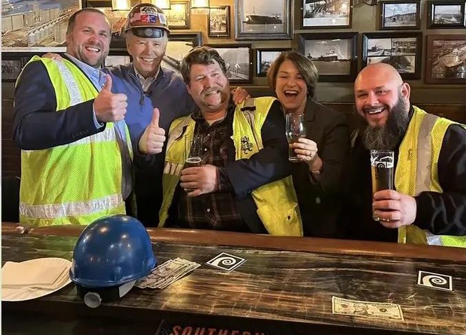 Did Biden Wear a Hard Hat Backwards in Photo Op with Construction Workers?